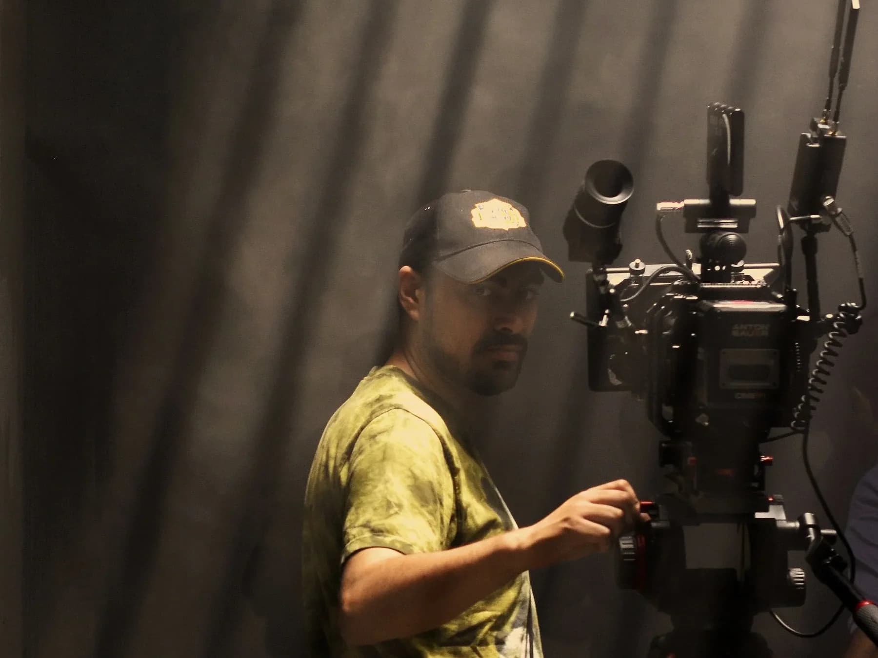 Mark Hobz operating a cinema camera on set